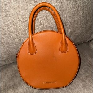 EXPRESSIONS NYC ROUND BAG